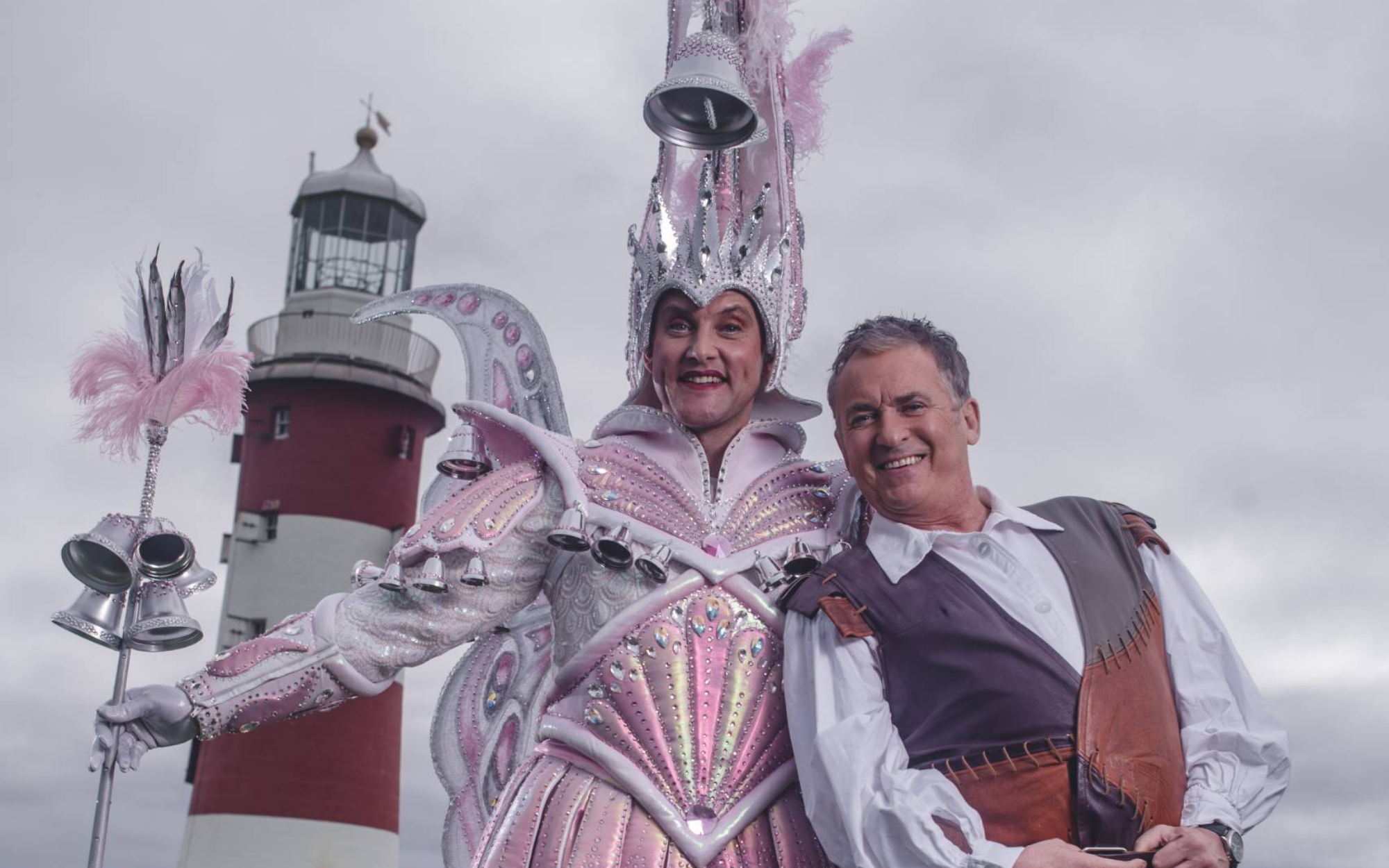 Dick Whittington (Shane RIchie) and the Spirit of Bow Bells (Samuel Holmes) posing in front of Smeaton's tower on The Hoe, Plymouth.